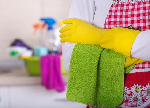 Office cleaners maintaining desks and meeting rooms in Roehampton